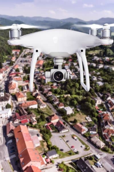 Drone aerial survey over city - ALTA SURVEY South Carolina Drone conducting an aerial survey above a city to capture mapping data and elevation details