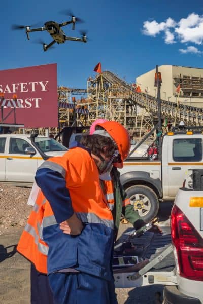 Surveyors using field technology and aerial data to perform an ALTA Title Survey and verify land accuracy after severe weather