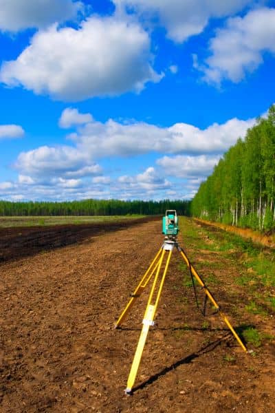 Total station surveying equipment field - ALTA SURVEY South Carolina Total station set up in the field to help locate missing property corners during a boundary line survey