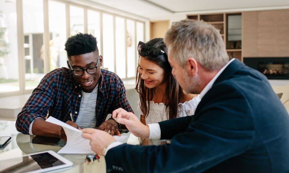 Buyers reviewing documents during a commercial real estate deal where an ALTA survey is ordered early as part of due diligence
